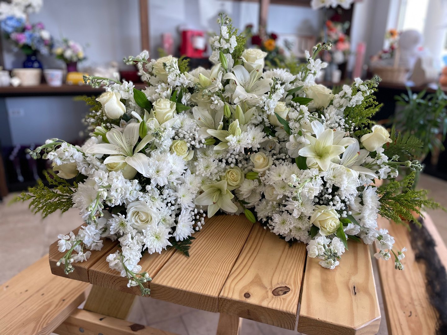 Elegant white lilies and roses with baby’s breath, perfect gift for free delivery in Florida areas.