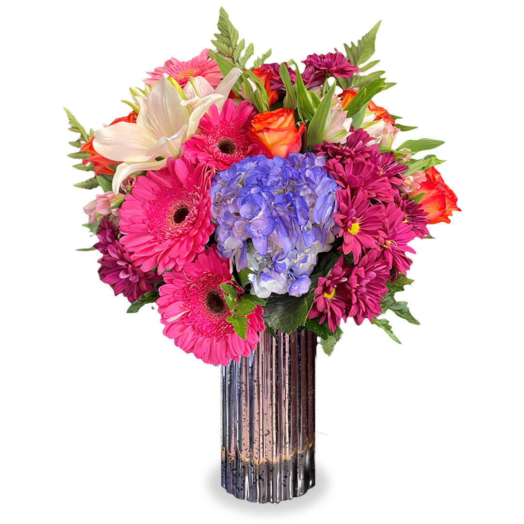 ondrous Wishes bouquet featuring blue hydrangea, 50cm orange roses, light pink lilies, and hot pink gerberas in a clear glass couture vase by Days Flowers Florida
