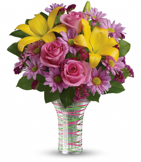 Vibrant bouquet with yellow lilies, pink roses, and purple accents in a striped vase, perfect for delivery in Summerfield, Ocala, Orlando, The Villages, and Port St. Lucie.